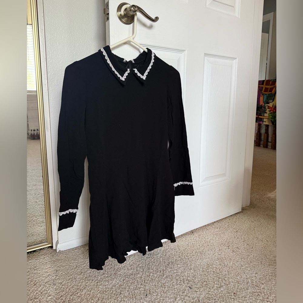 Reformation Black Garment with White Lace Detail
